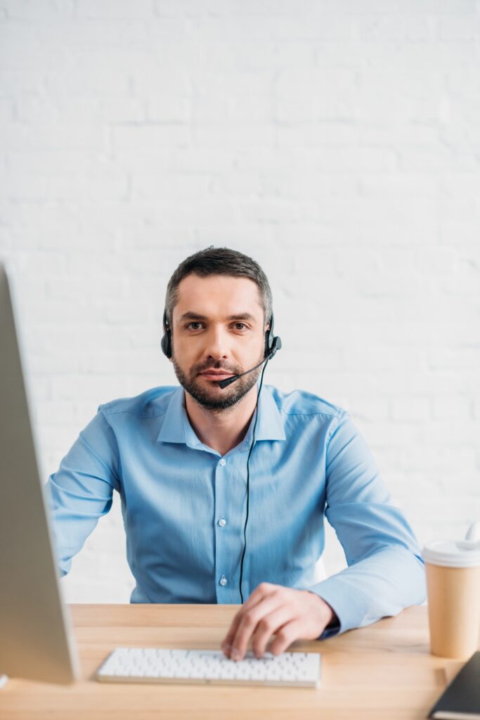 adult technical support professional working at office